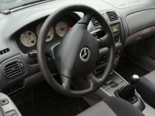 Mazda 323 6 поколение [рестайлинг] 2002г. 2.0 л., RF, дизель, МКПП - фото №2