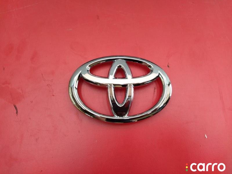 Значок тойота на руль. Тойота Витц передний значок. Размеры логотипа Toyota Camry xv50 передний.